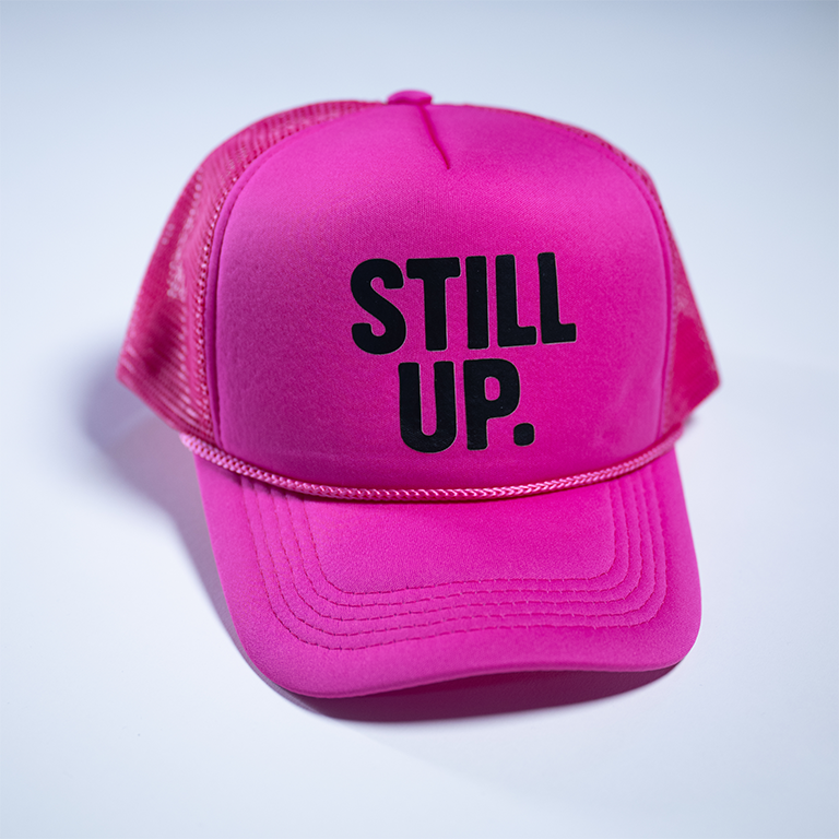 Classic Pink afters only. "STILL UP." Trucker Hat